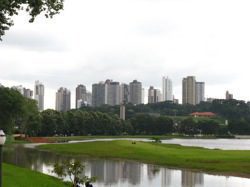 Urban areas all over the world are striving to lessen their environmental impacts by reducing waste, expanding recycling, lowering pollution and greenhouse gas emissions, and expanding open space. Pictured: Curitiba, Brazil, considered by many urban planners as the archetypal green city, as seen from Barigui Park