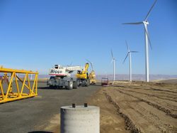 Most economists agree that it makes good sense to steer away from finite foreign oil toward homegrown renewable energy. Pictured: The Biglow Canyon Wind Farm under construction in Sherman County, Oregon
